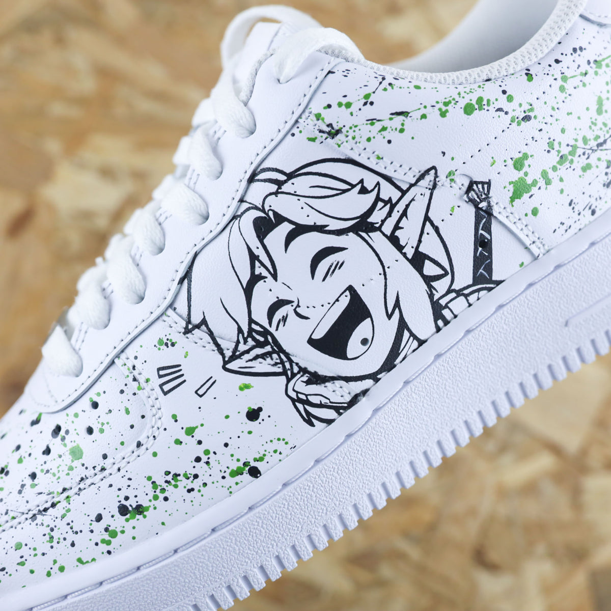 Baskets Nike Air force 1 custom - Zelda. Dessin de la princesse Zelda et du chevalier Link avec splash sneakeaze custom